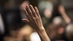 A constituent of Minnesota's 6th District raises their hand to ask a question of Rep Tom Emmer (R-MN) at a town hall meeting on February 22, 2017 in Sartell, Minnesota.