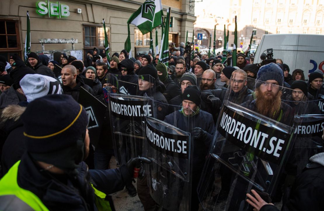 Members of the neo-nazi Nordic Resistance Movement hold an anti-migrant protest in Stockholm.
