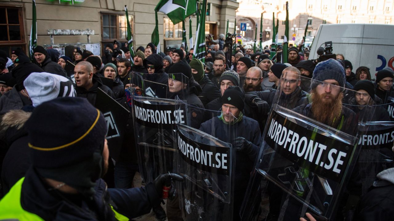Members of the neo-nazi Nordic Resistance Movement hold an anti-migrant protest in Stockholm.