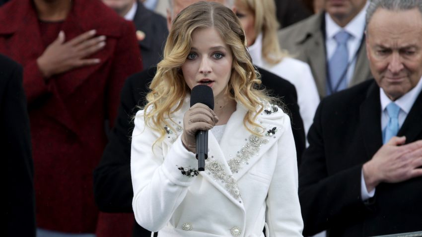 WASHINGTON, DC - JANUARY 20: Former president Barack Obama places his hand on his heart as Jackie Evancho sings the national anthem on the West Front of the U.S. Capitol on January 20, 2017 in Washington, DC. In today's inauguration ceremony Donald J. Trump becomes the 45th president of the United States.  (Photo by Alex Wong/Getty Images)