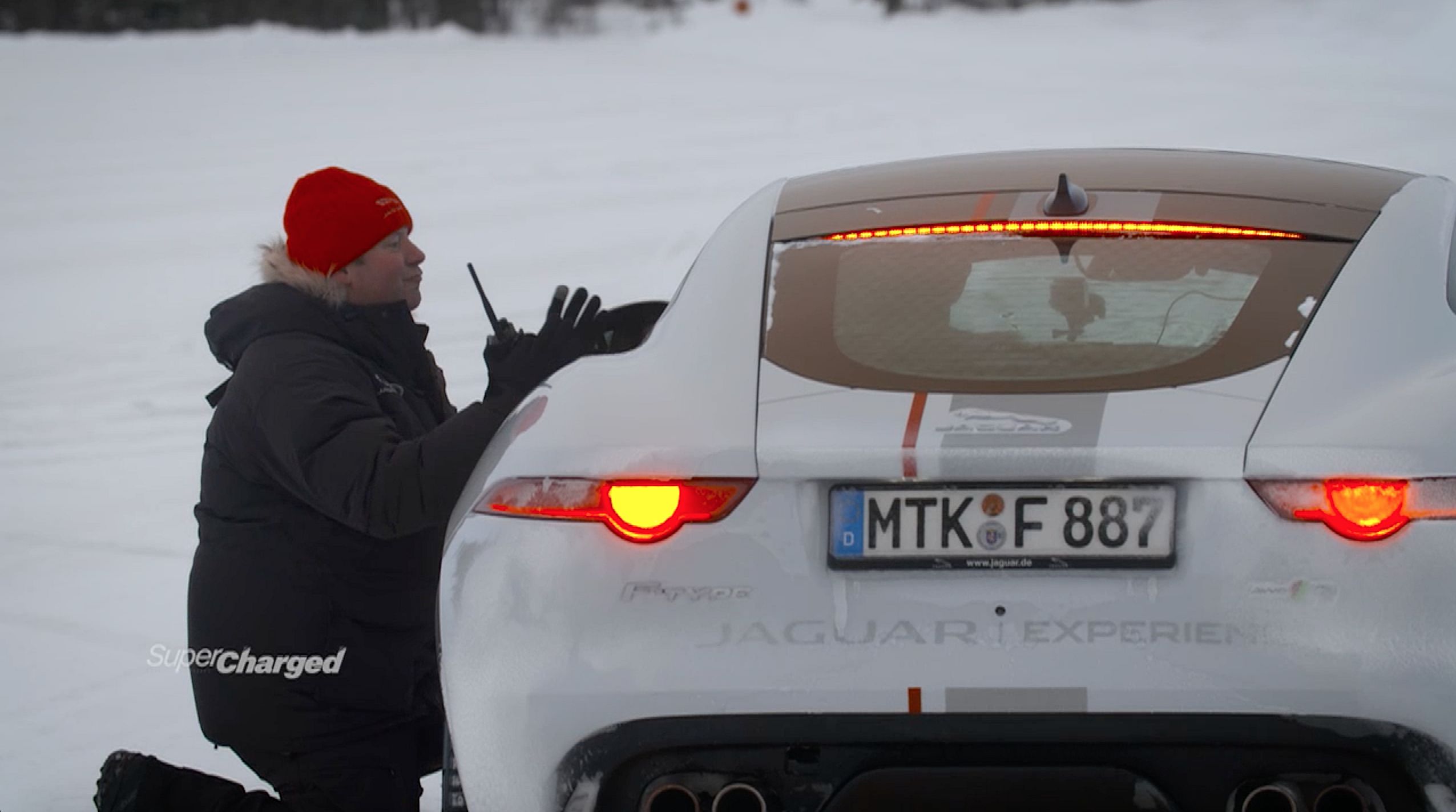 Ian Kitching, a lead instructor for Jaguar Land Rover Experience, gives Evans some tips on how to perfect the "Scandinavian flick."  