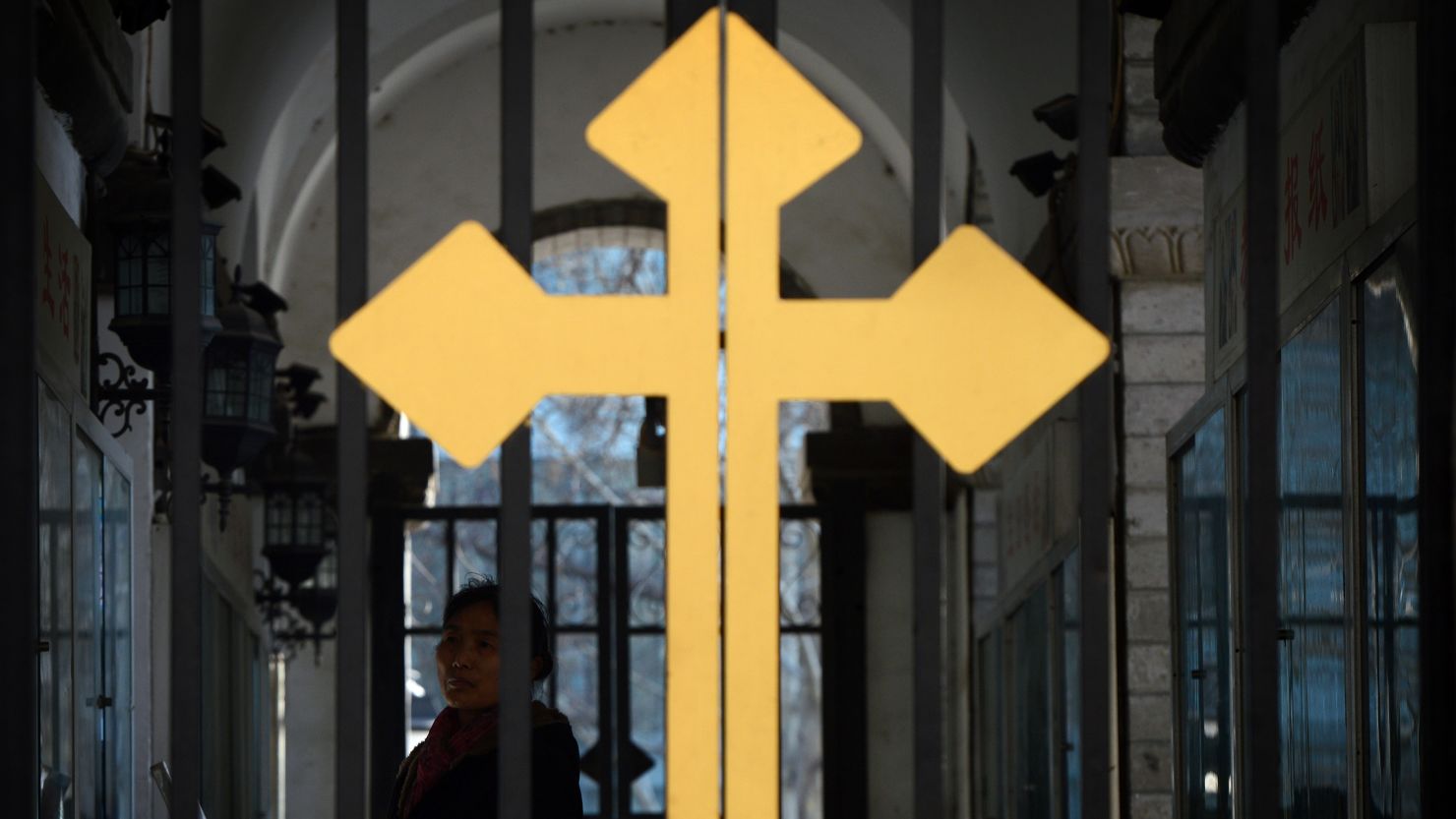 A Chinese Catholic arrives for a church service at the East Cathedral in Beijing in February 2013.