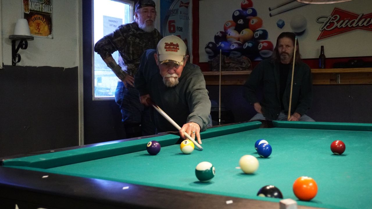 Retired workers from the nearby power plants shoot pool in Manchester's one bar, Bottoms Up.