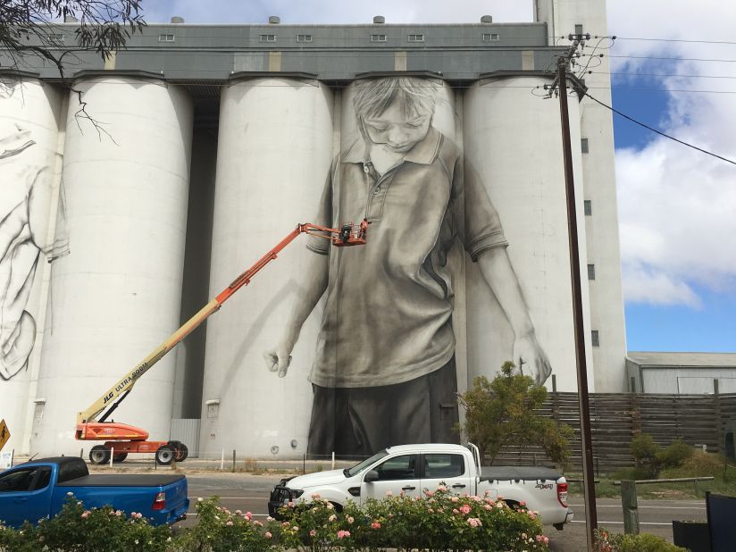 Australian artists Guido van Helten works on his latest mural project, a grain silo in the South Australian town of Coonalpyn.