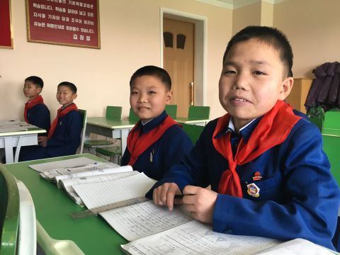 Boys in Pyongyang pose for a photo at a secondary school for orphans on February 19.