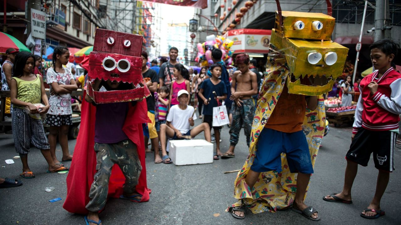 Boxing clever in Manila. Homemade dragon outfits are the order of the day in Binondo.
