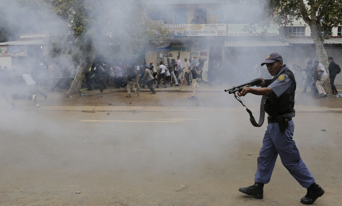 Police forces shot rubber bullets at crowds during a march. Local South African residents have been attacking foreign-owned shops in the city this week, looting goods. 