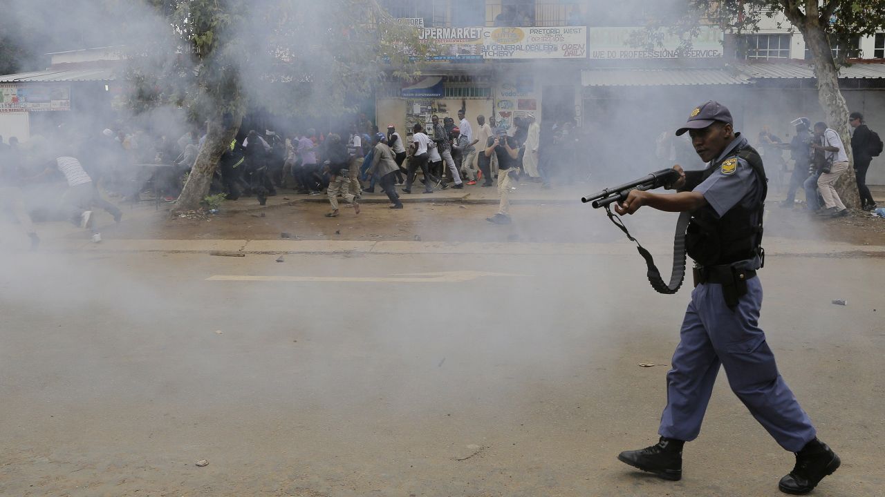 Police forces shot rubber bullets at crowds during a march. Local South African residents have been attacking foreign-owned shops in the city this week, looting goods.
