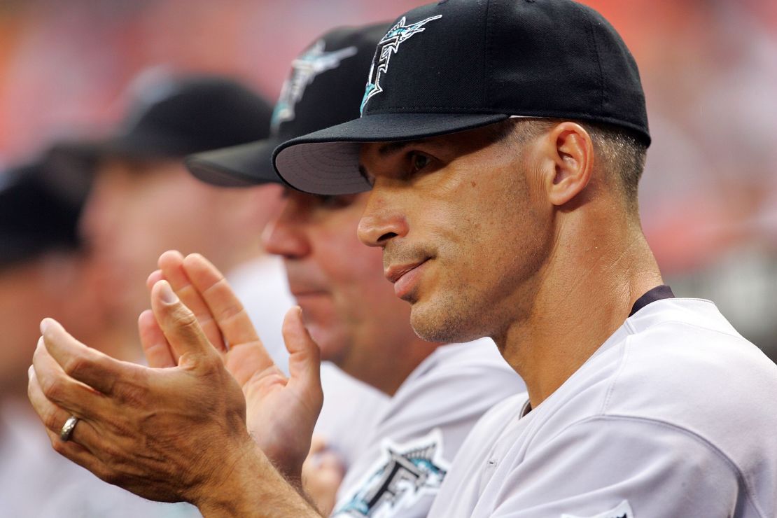 Manager Joe Girardi claps as the Marlins score four runs in the 2nd inning against the Washington Nationals on July 5, 2006, during his brief tenure in Florida.