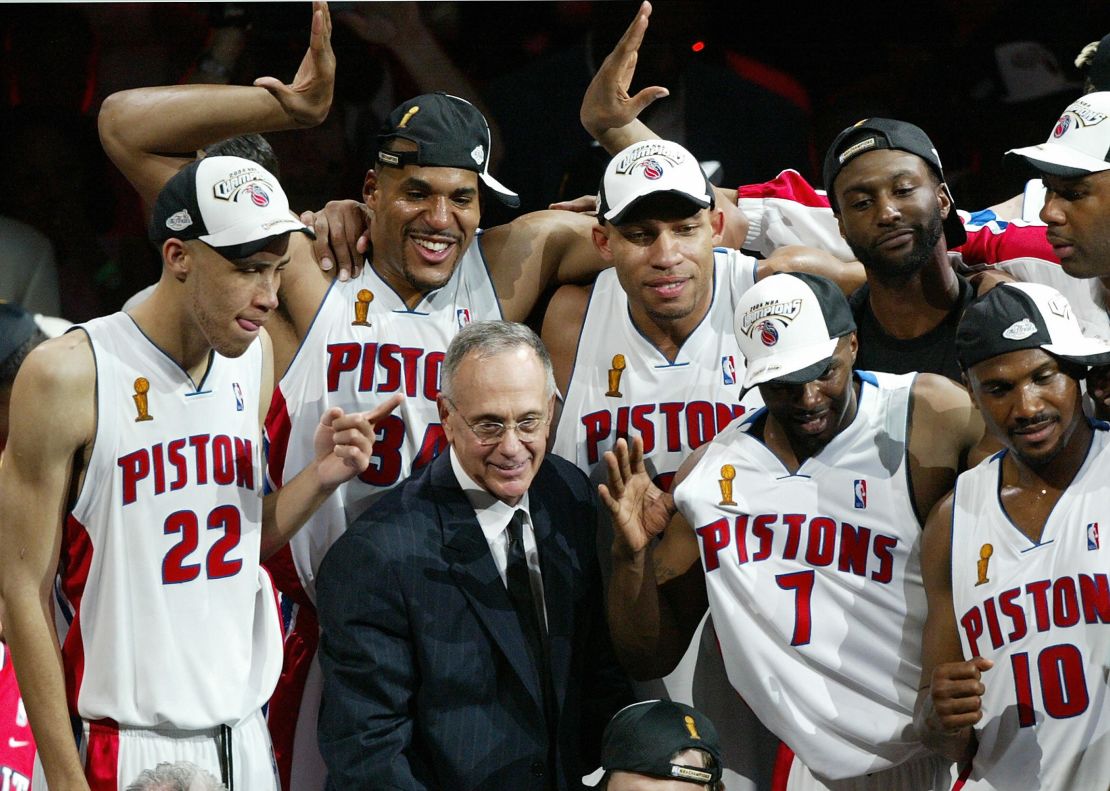 Detroit Piston coach Larry Brown celebrates with players after the Pistons defeated the Lakers 100-87 to win the 2004 NBA championship final, in Auburn Hills, MI, 15 June 2004. 