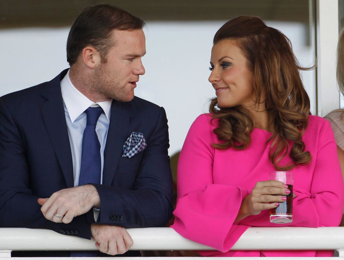 Rooney (left) with his wife Coleen.