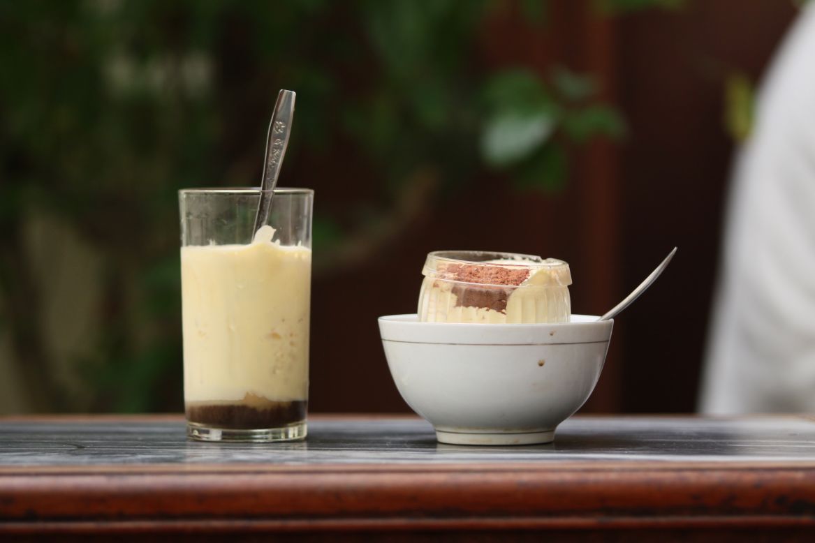 <strong>Hot and cold: </strong>Visitors can order either hot or cold versions of Cafe Giang's egg coffee. The cold version, consumed with a spoon, almost tastes lke a coffee-flavored ice cream.  The hot version comes resting in a small dish of hot water to maintain its temperature. 