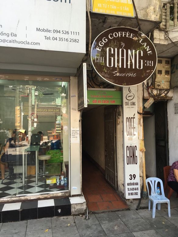 <strong>Hard to find: </strong>Blink and you'll miss Cafe Giang's narrow, dark doorway and sign. To enter, you need to walk through a hallway, which opens out to a two-story cafe. 