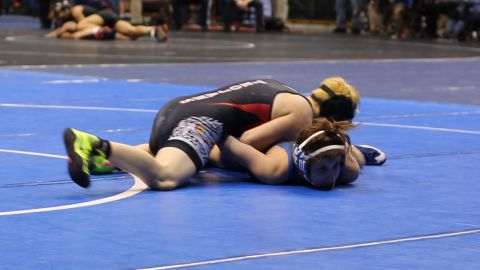 Transgender boy Mack Beggs, in red and black, was allowed to compete only against girls this year.