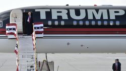 US Republican presidential nominee Donald Trump steps off his plane as he arrives for a rally at the Airborne Maintenance & Engineering Services, Inc. in Wilmington, Ohio on November 4, 2016. / AFP / MANDEL NGAN        (Photo credit should read MANDEL NGAN/AFP/Getty Images)