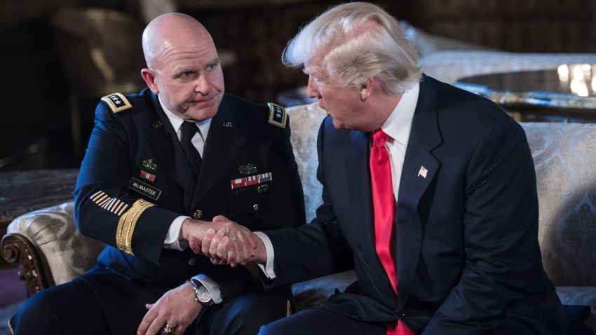 US President Donald Trump shakes hands with US Army Lieutenant General H.R. McMaster (L) as his national security adviser at his Mar-a-Lago resort in Palm Beach, Florida, on February 20, 2017. / AFP / NICHOLAS KAMM