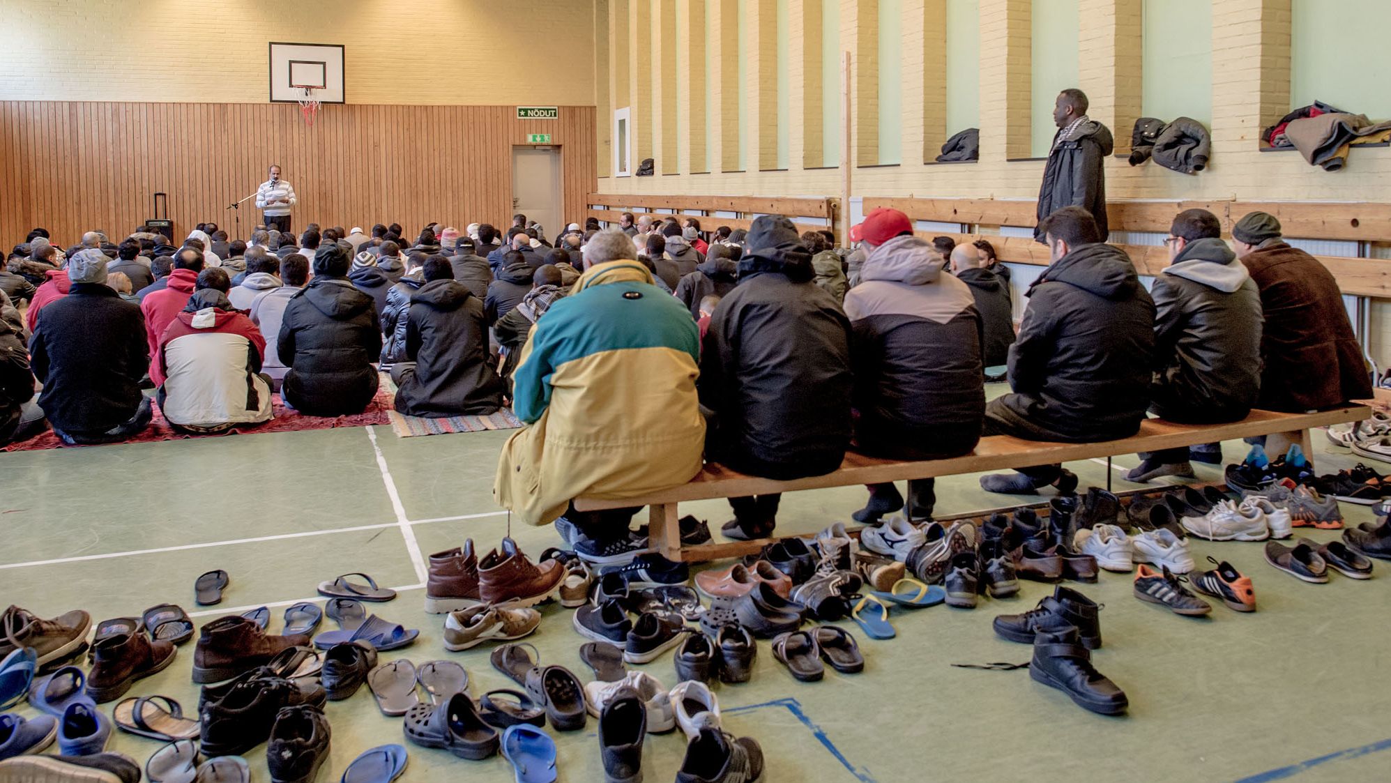 Refugees pray in the gym of the former psychiatric hospital Restad Farm in Vanersborg, Sweden, earlier this month.