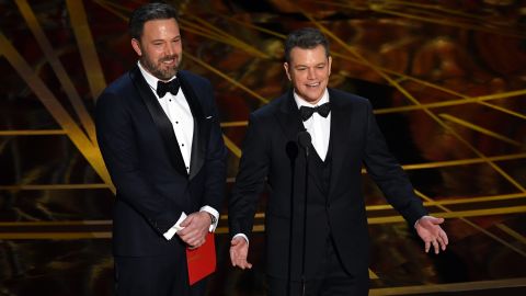 Ben Affleck and Matt Damon speak onstage during the 89th Annual Academy Awards.