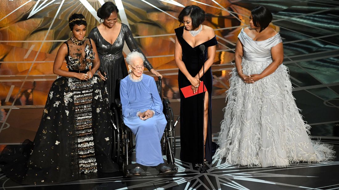 Former NASA physicist and mathematician Katherine Johnson, third from left, appears on stage with some of the leading ladies of "Hidden Figures": Janelle Monae, Taraji P. Henson and Octavia Spencer. "Hidden Figures" is a true story about the unsung African-American women whose math and engineering smarts helped power the US space program in the 1960s.