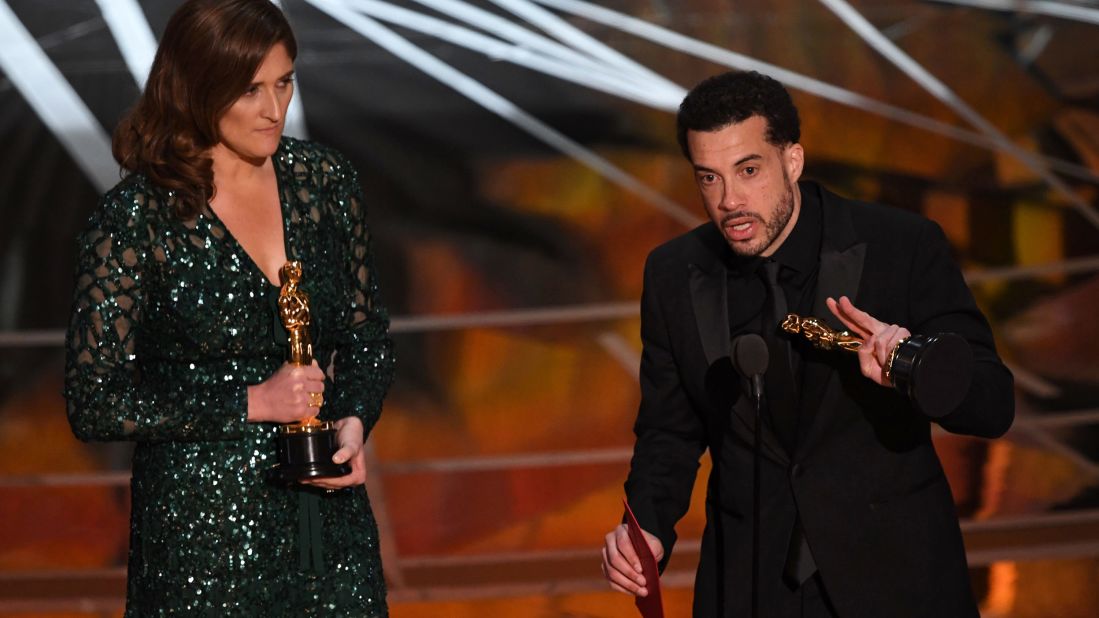 Director Ezra Edelman delivers a speech next to producer Caroline Waterlow after "O.J.: Made In America" won the Oscar for best documentary feature. "O.J.: Made In America" was a five-part miniseries that explored the life of former football star O.J. Simpson.