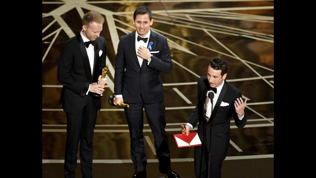 From left, songwriters Justin Paul, Benj Pasek and Justin Hurwitz accept the Oscar for best original song ("City of Stars" from the movie "La La Land").