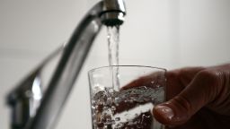 Tap water fills a glass on February 26, 2014 in the French southern city of Marseille. AFP PHOTO/ANNE-CHRISTINE POUJOULAT        (Photo credit should read ANNE-CHRISTINE POUJOULAT/AFP/Getty Images)