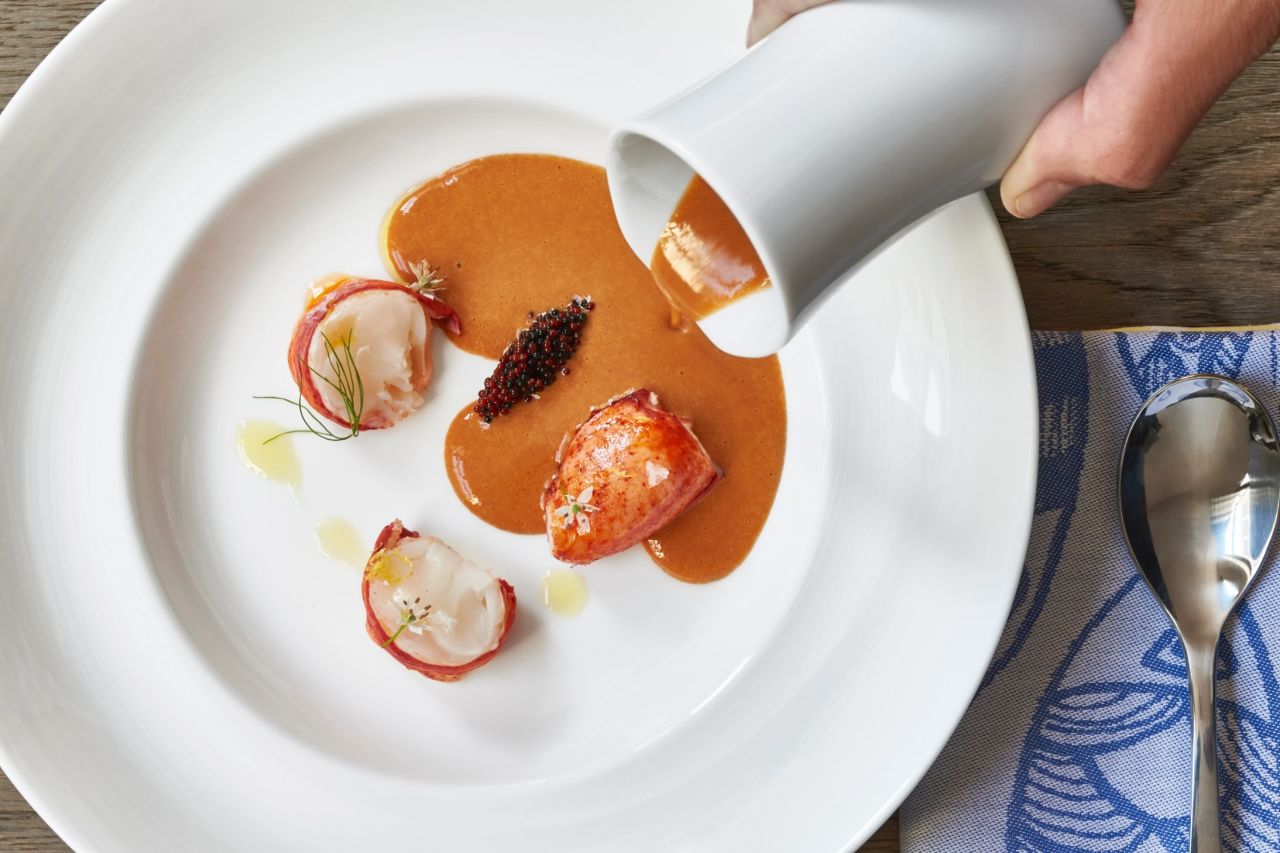Maine lobster bisque joins Virginia oysters and clams on the menu at Fish By José Andrés.