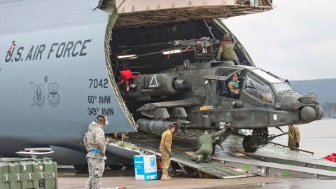 An Apache attack helicopter is being unloaded from a Galaxy C-5 transport plane at the US Air Base in Ramstein, western Germany, on February 22, 2017.