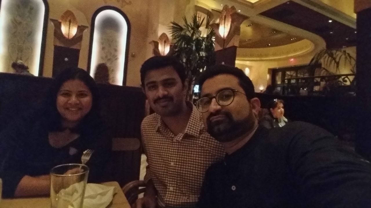 Shooting victim Srinivas Kuchibhotla (center), seen here at a Kansas City restaurant with his wife Sunayana and friend Somil Chandwani (right).