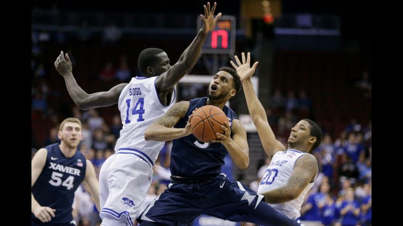 Xavier guard Trevon Bluiett tries to evade Seton Hall defenders during a Big East basketball game in Newark, New Jersey, on Wednesday, February 22.