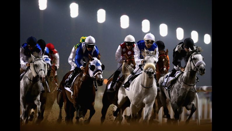 Horses race at the Meydan track in Dubai, United Arab Emirates, on Thursday, February 23.