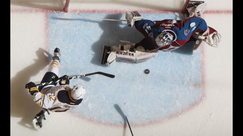 Colorado goalie Jeremy Smith makes a save on Buffalo's Brian Gionta during an NHL game in Denver on Saturday, February 25. Smith earned the first win of his career as the Avalanche defeated the Sabres 5-3.