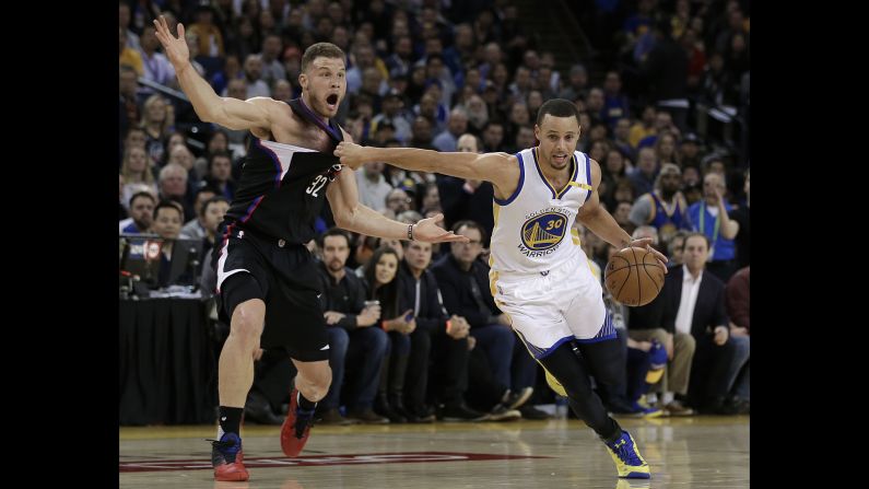 Golden State's Stephen Curry drives past Los Angeles Clippers forward Blake Griffin during an NBA game in Oakland, California, on Thursday, February 23.
