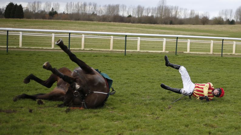 Paddy Brennan and his horse, Global Stage, fall at the last obstacle during a race in Warwick, England, on Friday, February 24.
