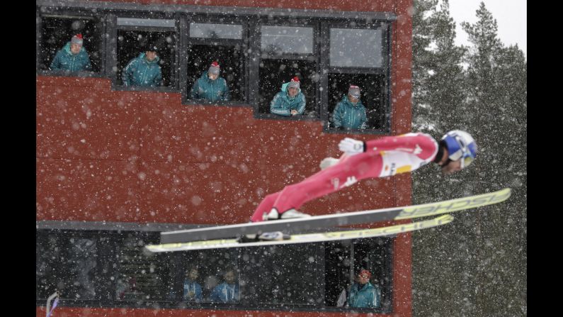 Judges watch Italian ski jumper Alessandro Pittin during the World Championships in Lahti, Finland, on Sunday, February 26.