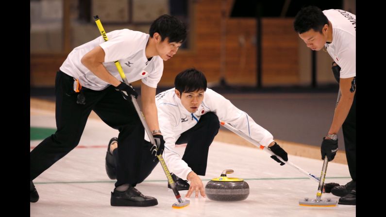 Japan's Yusuke Morozumi throws the stone during the curling final of the Asian Winter Games on Friday, February 24. China won the final 11-4.