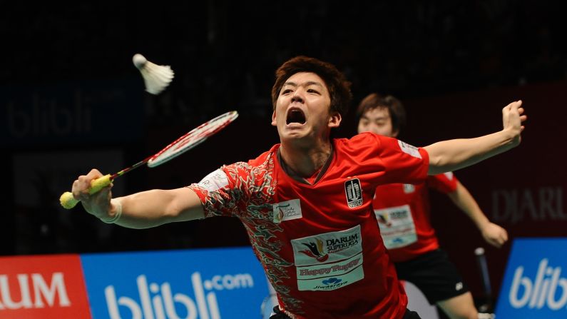 Lee Yong-dae plays a shot during a badminton match in Surabaya, Indonesia, on Sunday, February 26.