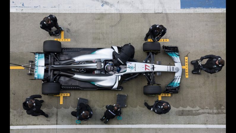 An overhead view shows Formula One driver Valtteri Bottas and <a href="index.php?page=&url=http%3A%2F%2Fwww.cnn.com%2F2017%2F02%2F24%2Fmotorsport%2Flewis-hamilton-valterri-bottas-mercedes-f1%2Findex.html" target="_blank">Mercedes' 2017 car</a> on Thursday, February 23. Bottas is replacing Nico Rosberg, who retired after winning last season's title.
