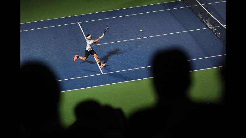 Roger Federer plays a forehand Monday, February 27, during a match in Dubai, United Arab Emirates.