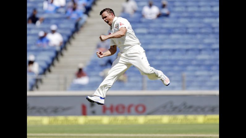 Australia's Steve O'Keefe celebrates the dismissal of India's Virat Kohli during a cricket match in Pune, India, on Saturday, February 25.