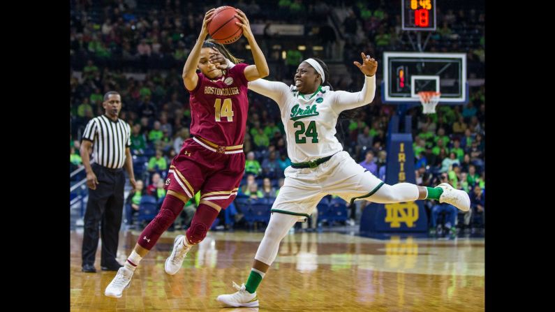 Boston College's Kailey Edwards is hit in the face by Notre Dame's Arike Ogunbowale as she grabs a pass in South Bend, Indiana, on Thursday, February 23. 