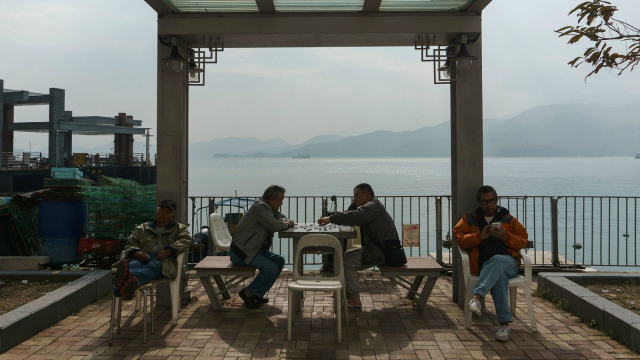 Keeping the excitement in check with a game of Chinese chess.
