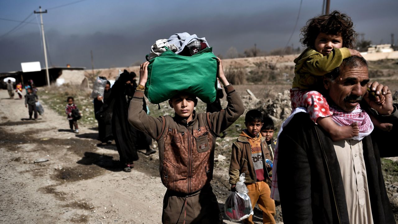 Displaced Iraqis flee the city of Mosul during an operation to retake the city from ISIS.