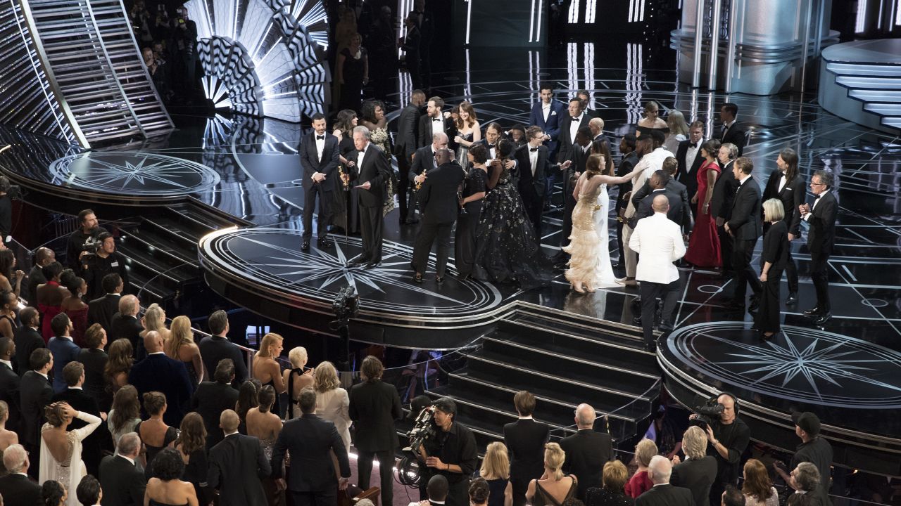 The scene at the Oscars after "La La Land" was mistakenly announced as the best picture winner instead of "Moonlight." On stage, the casts trade places as presenter Warren Beatty explains the snafu. In the crowd, Chrissy Teigen can be seen with her hands on her head in shock.