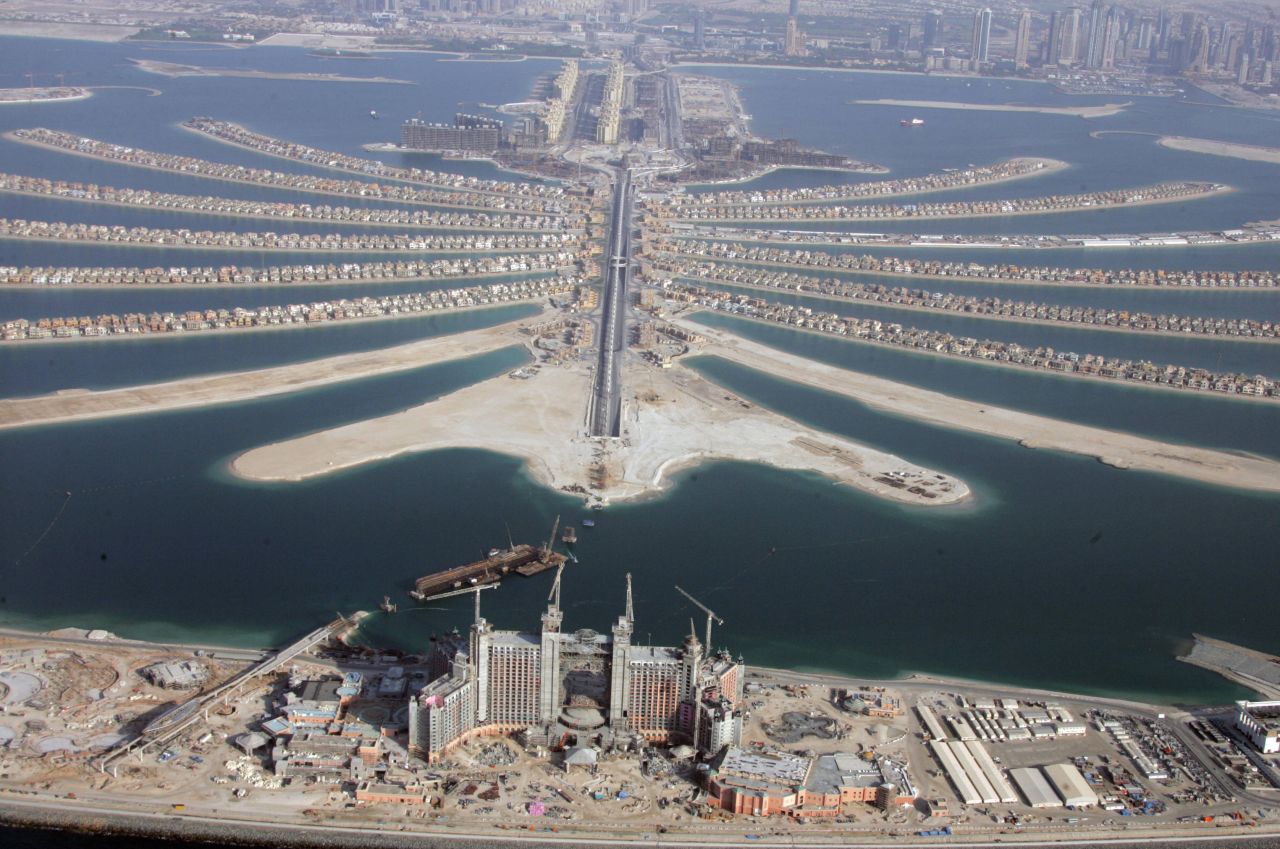 This is a view of the Palm Islands in 2007. The islands house hotels, spas, beaches and residential buildings. In the foreground is the luxury hotel Atlantis The Palm, still under construction at this time.