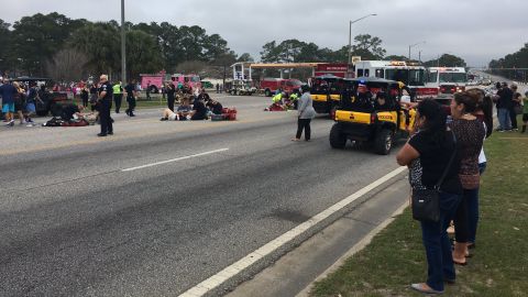 Emergency crews respond to the scene of the parade, which was canceled.
