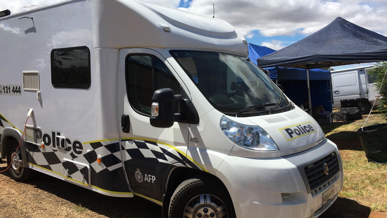 An AFP vehicle in front of the Young house where the 42-year-old Australian, accused of assisting ISIS, was arrested.