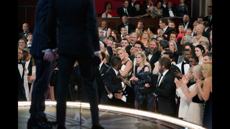 The stunned audience reacts to the correction of the mistake.