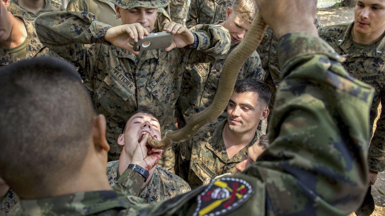 A US Marine drinks cobra blood during the Cobra Gold training exercise in Thailand on Friday, February 17. Royal Thai Marines demonstrated various methods of surviving in the jungle. Cobra blood and flesh are used as nutrition in a scenario where sustenance is scarce.