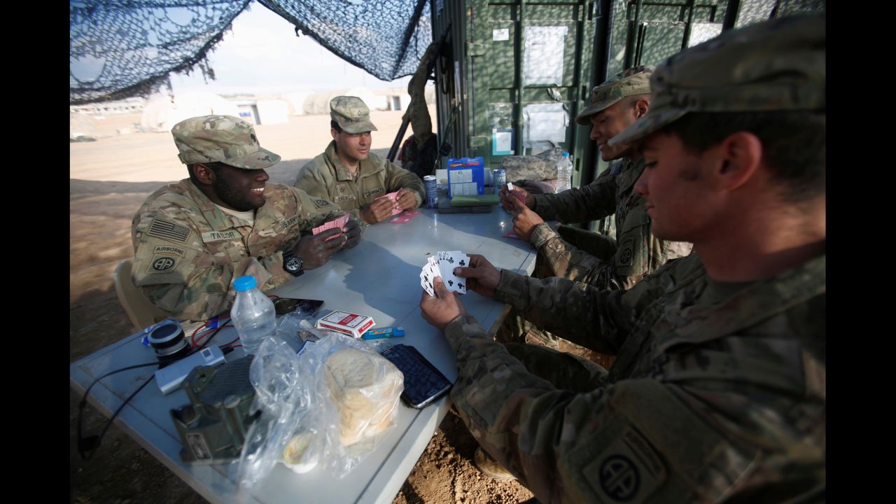 US troops play poker at a military base north of Mosul, Iraq, on Tuesday, February 14.